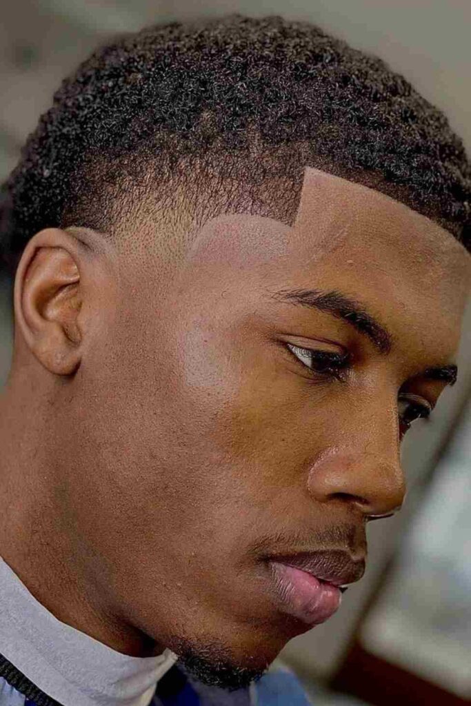 Low Taper Fade for Black Men 6 Curly Crop with Tapered Temples